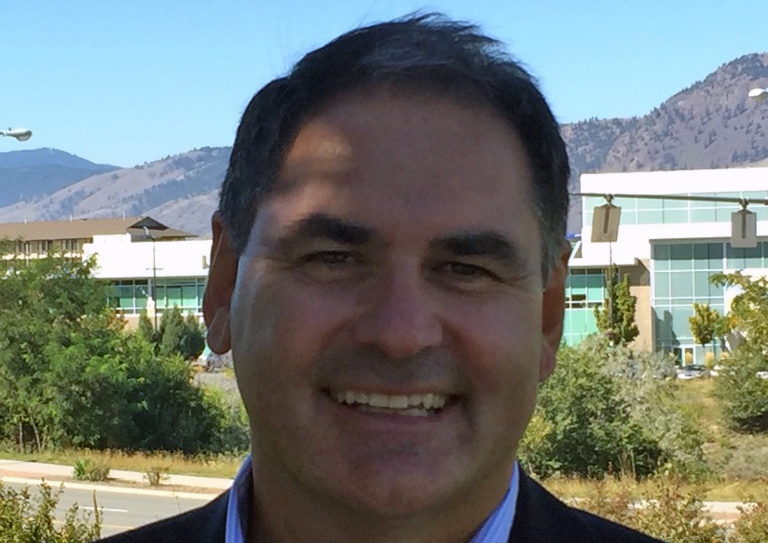 A close-up headshot of a man