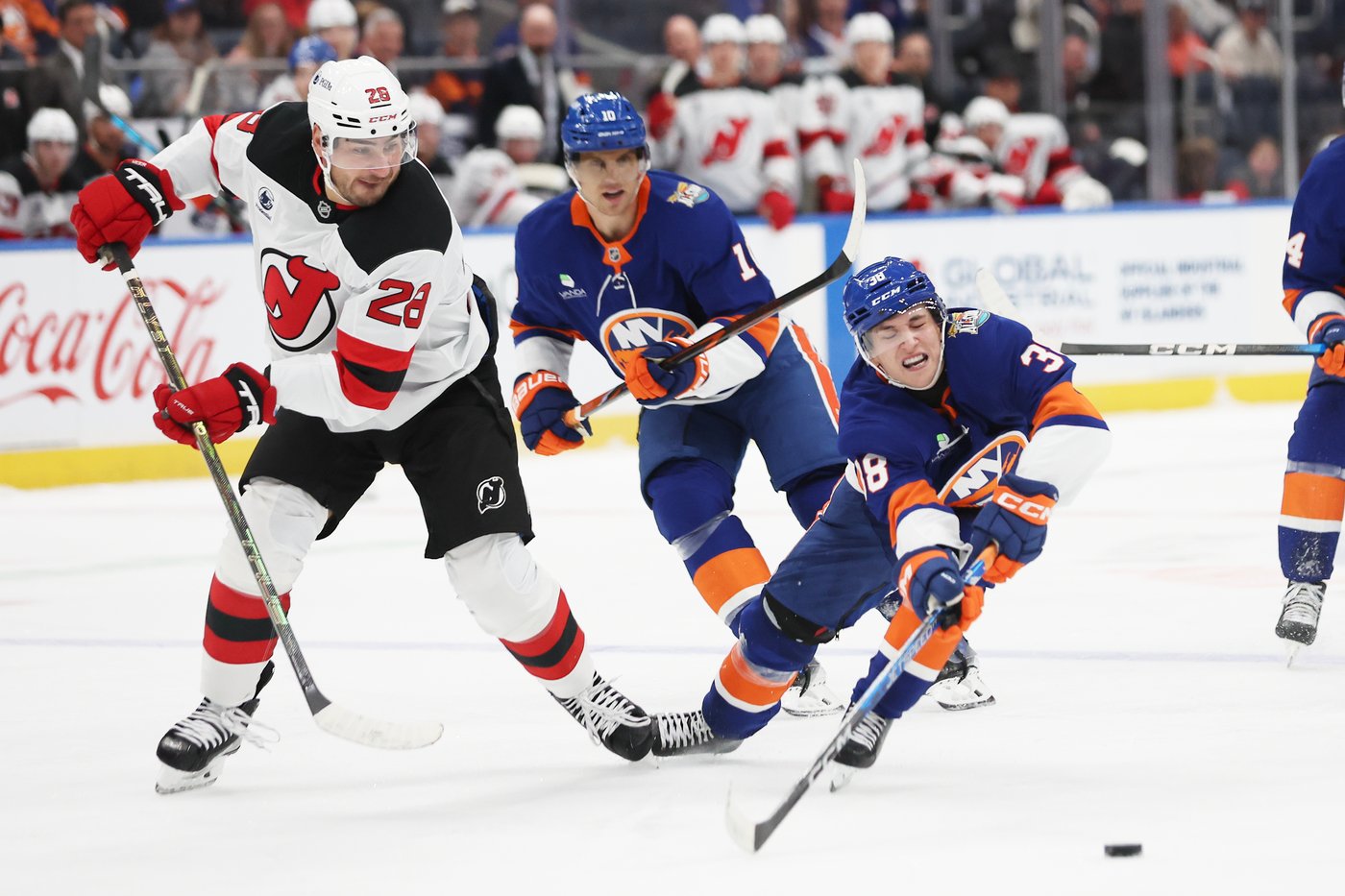 Victor Eklund battles Timo Meier during the Islanders' win over the Devils