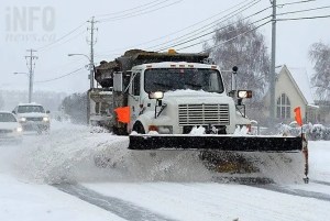 A snow plow on a snowy day.