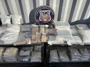 A table with drugs and cash on it.