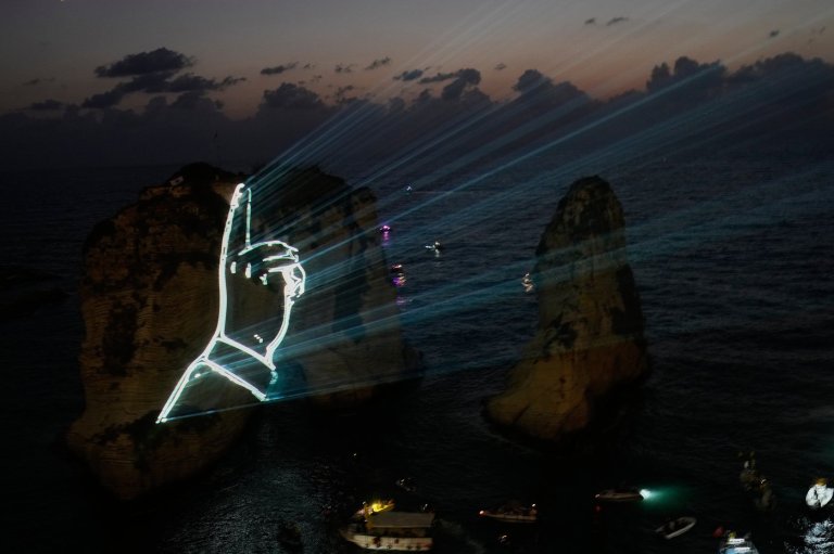 Hezbollah defies Lebanon PM's ban to honor fallen leaders with coastal light show | iNFOnews.ca