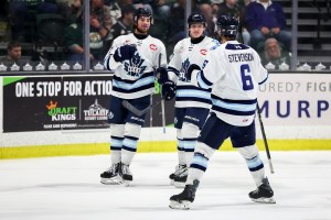Three Penticton Vees players on the ice at the South Okanagan Events Centre.