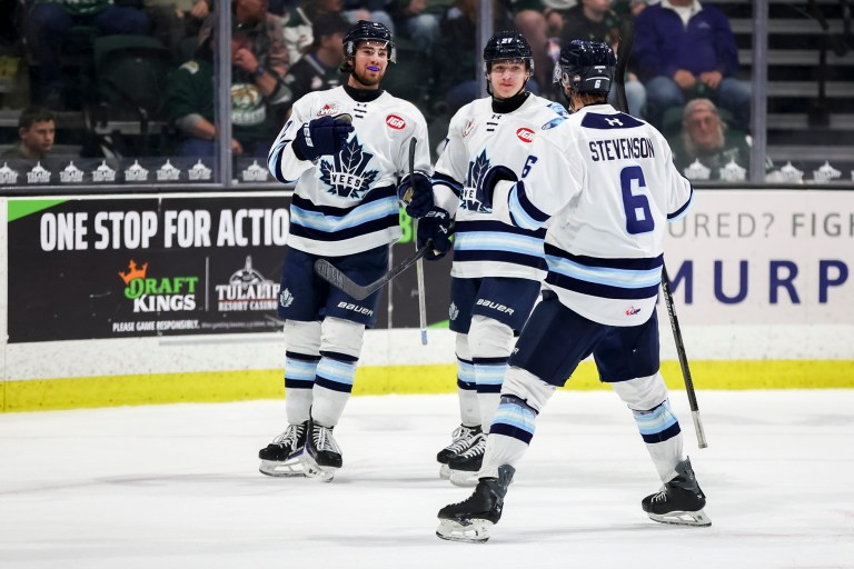 Three Penticton Vees players on the ice at the South Okanagan Events Centre.