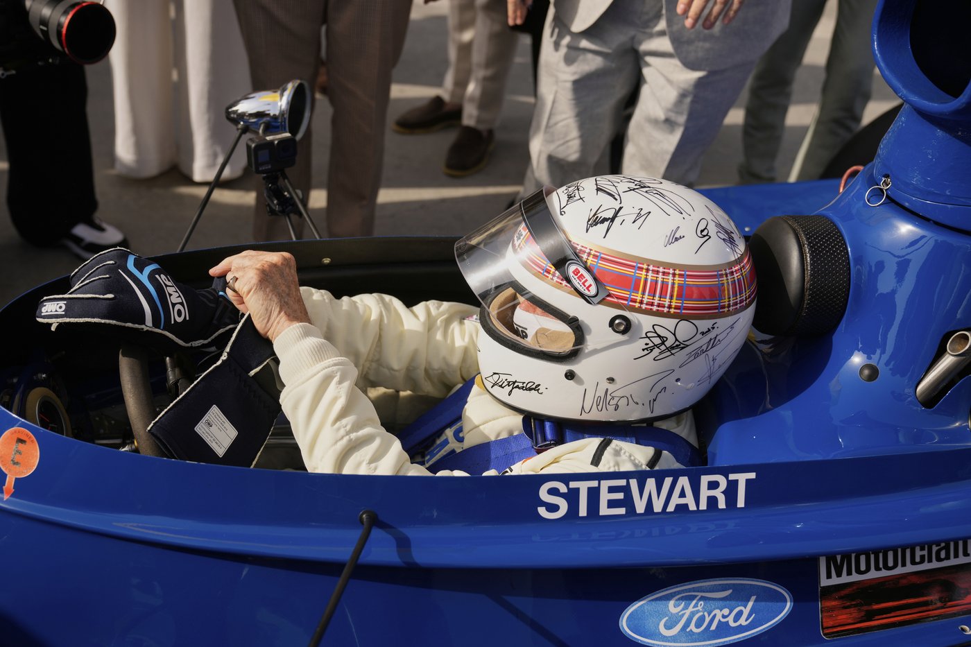 Michael Schumacher's signature on helmet worn by F1 champ Jackie Stewart at charity drive in Bahrain | iNFOnews.ca