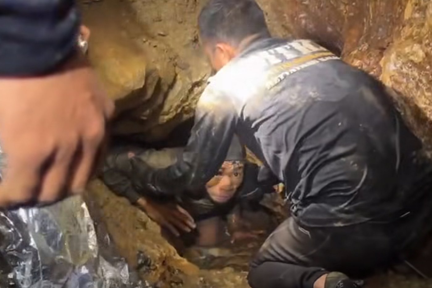 Rescuers search for alternative route to reach 2 missing in a flooded Laos cave | iNFOnews.ca