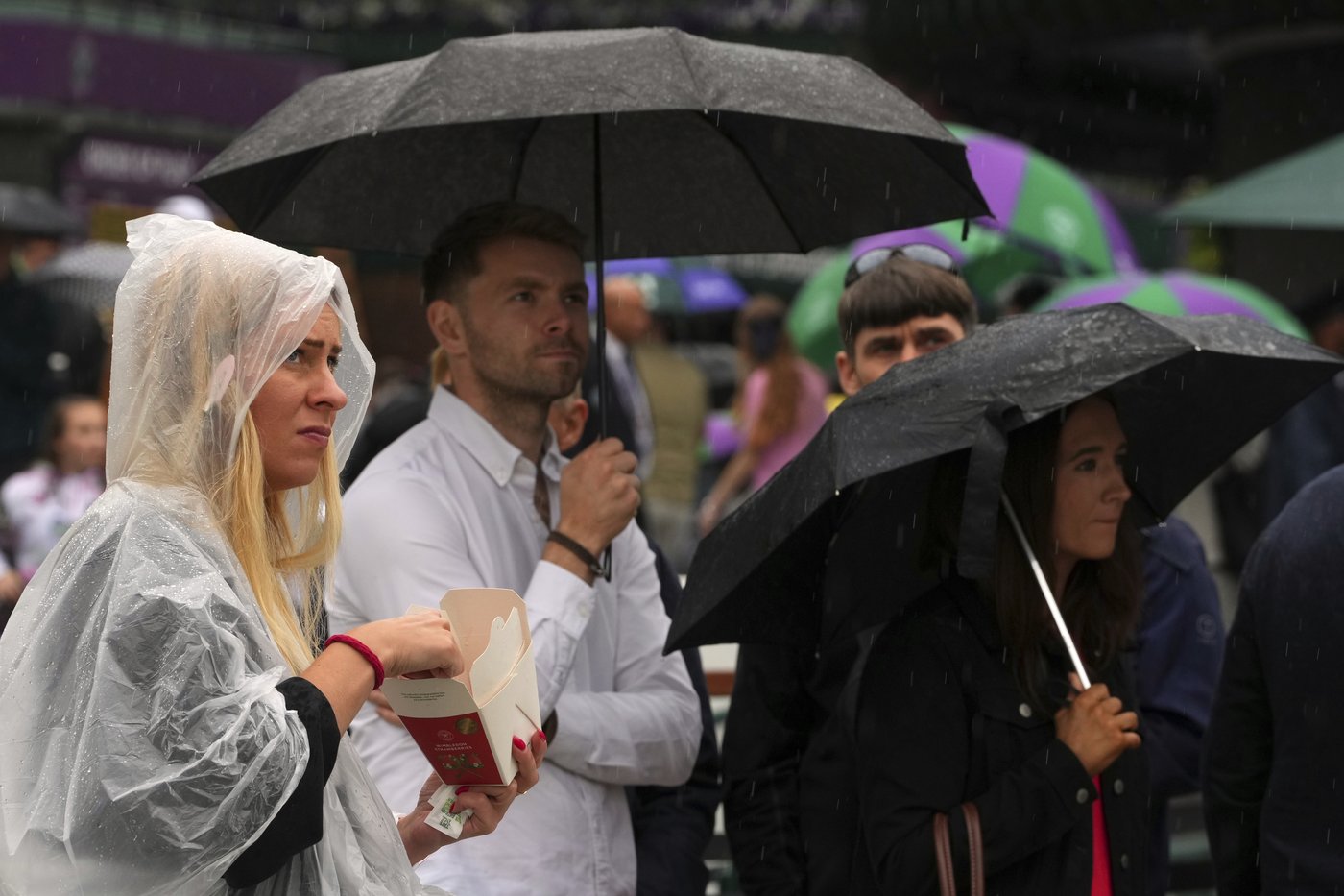 Photos show the rain on Day 3 after the Wimbledon heatwave | iNFOnews.ca