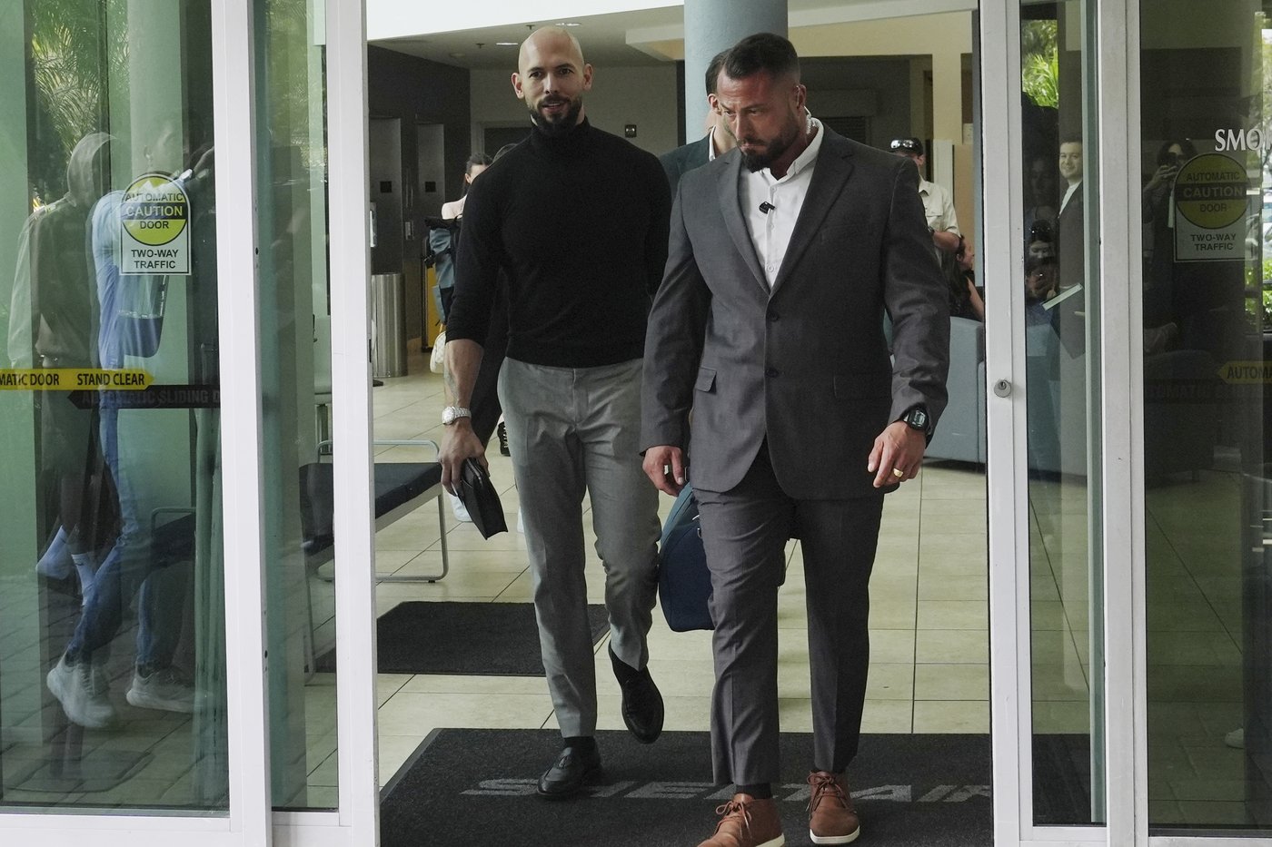 Influencer Tate brothers, who face human trafficking charges in Romania, arrive in the US | iNFOnews.ca Influencer Tate brothers, who face human trafficking charges in Romania, arrive in the US | iNFOnews.ca