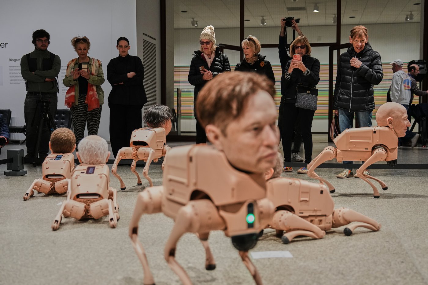 Robot dogs with Musk and Zuckerberg heads roam around Berlin museum in Beeple's new exhibit | iNFOnews.ca