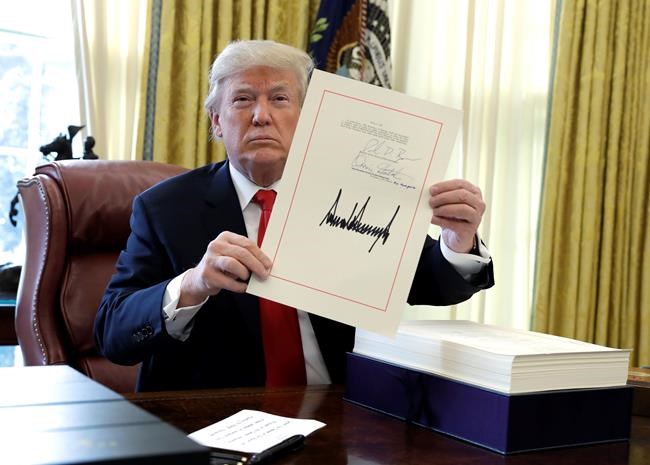 With stroke of pen signing major bill, Trump caps a consequential first year | iNFOnews.ca
