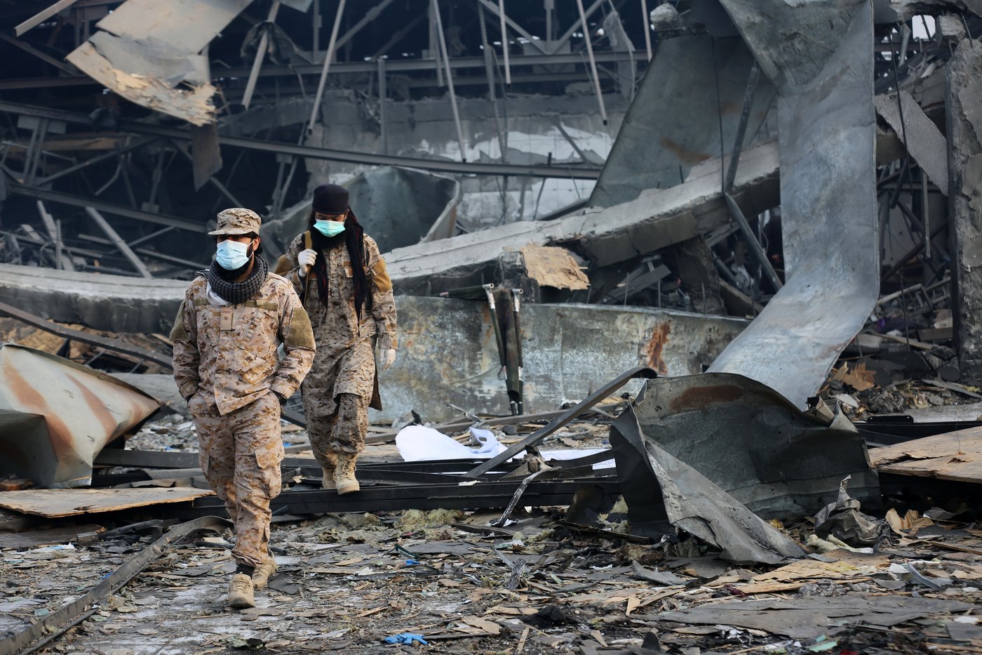 Rescue crews race through rubble after a deadly Kabul airstrike, in photos | iNFOnews.ca