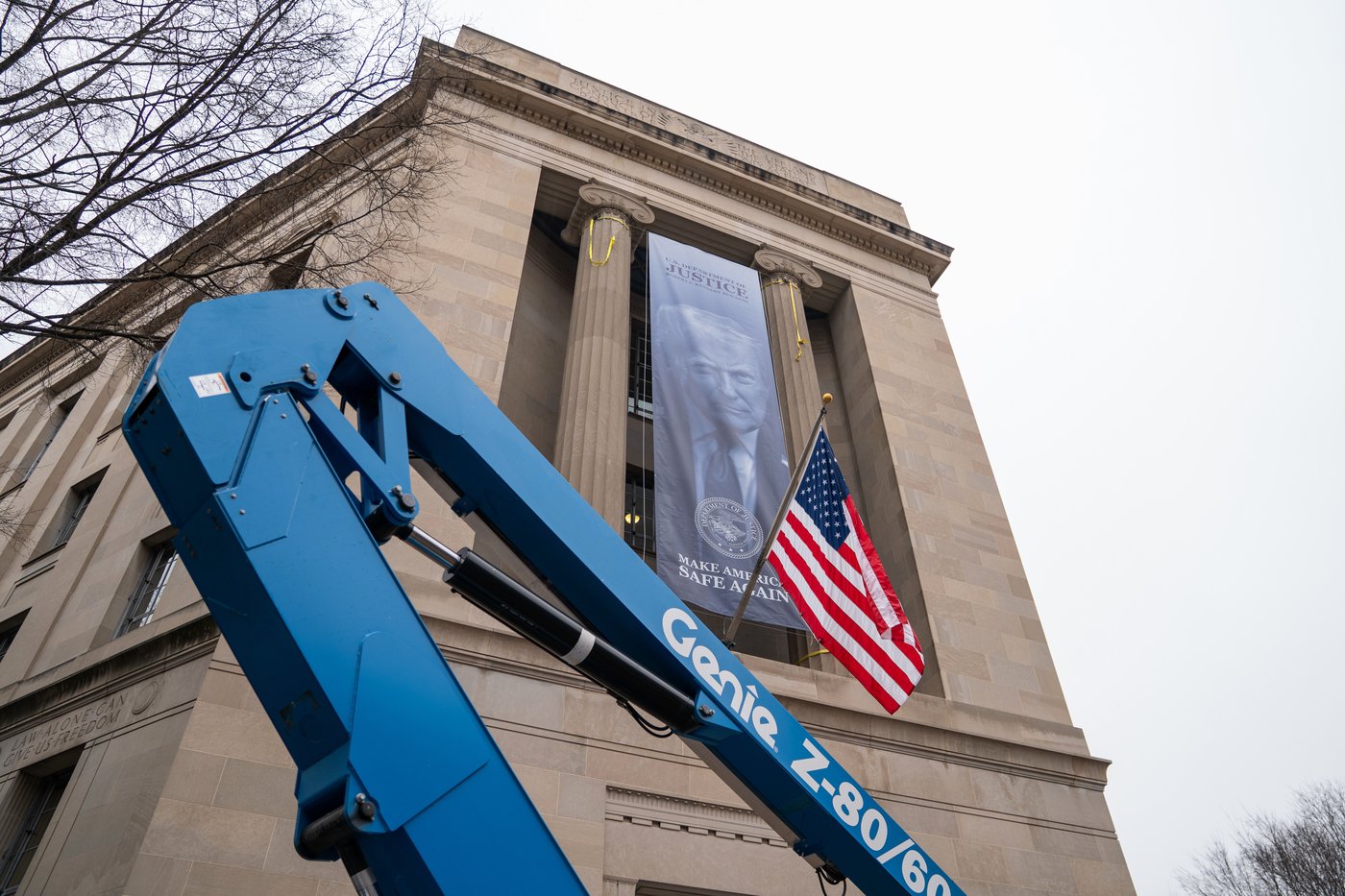 Large banner featuring Trump's face is displayed on Justice Department headquarters | iNFOnews.ca