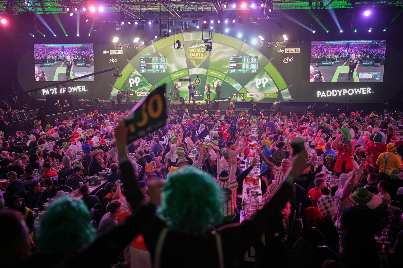 Costumes and competitors light up the World Darts Championships in London, in photos | iNFOnews.ca