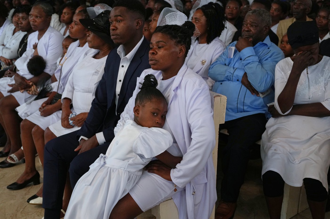 Mourners file into a church in Haiti where gangs killed dozens of people in latest rampage | iNFOnews.ca