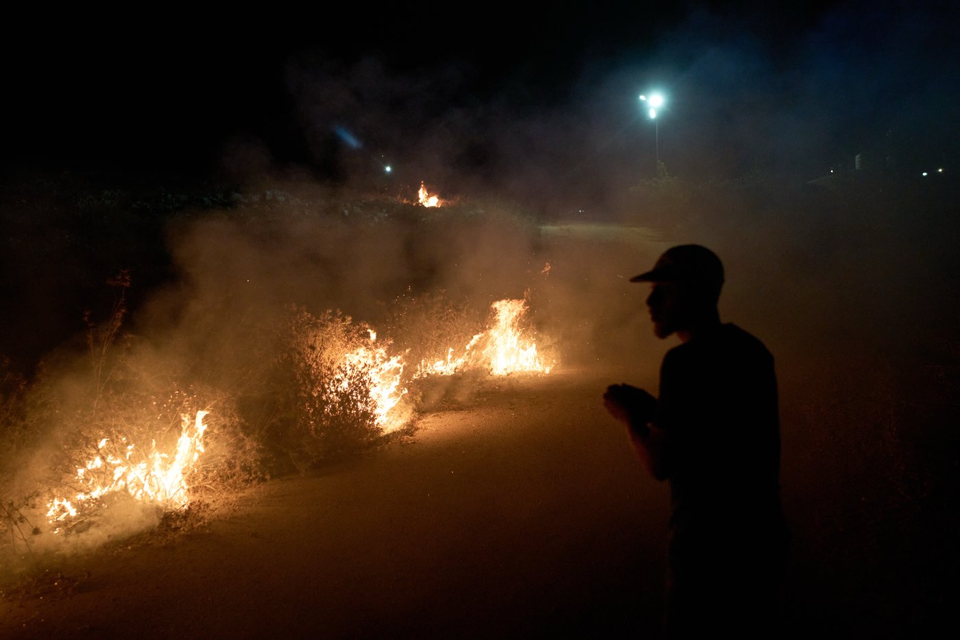 Photos show West Bank Palestinians keeping watch at night as settler violence grows | iNFOnews.ca