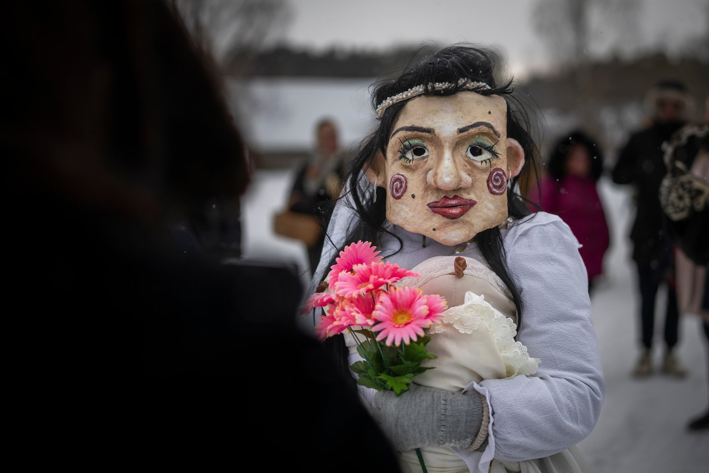 Photos show masked revelers celebrating Shrovetide in Lithuania | iNFOnews.ca