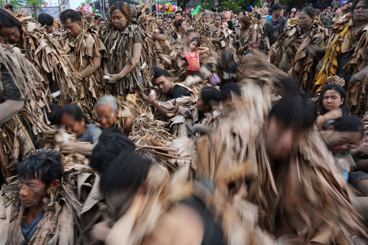 Photos show Philippine Catholics smearing mud on their bodies for festival honoring John the Baptist | iNFOnews.ca