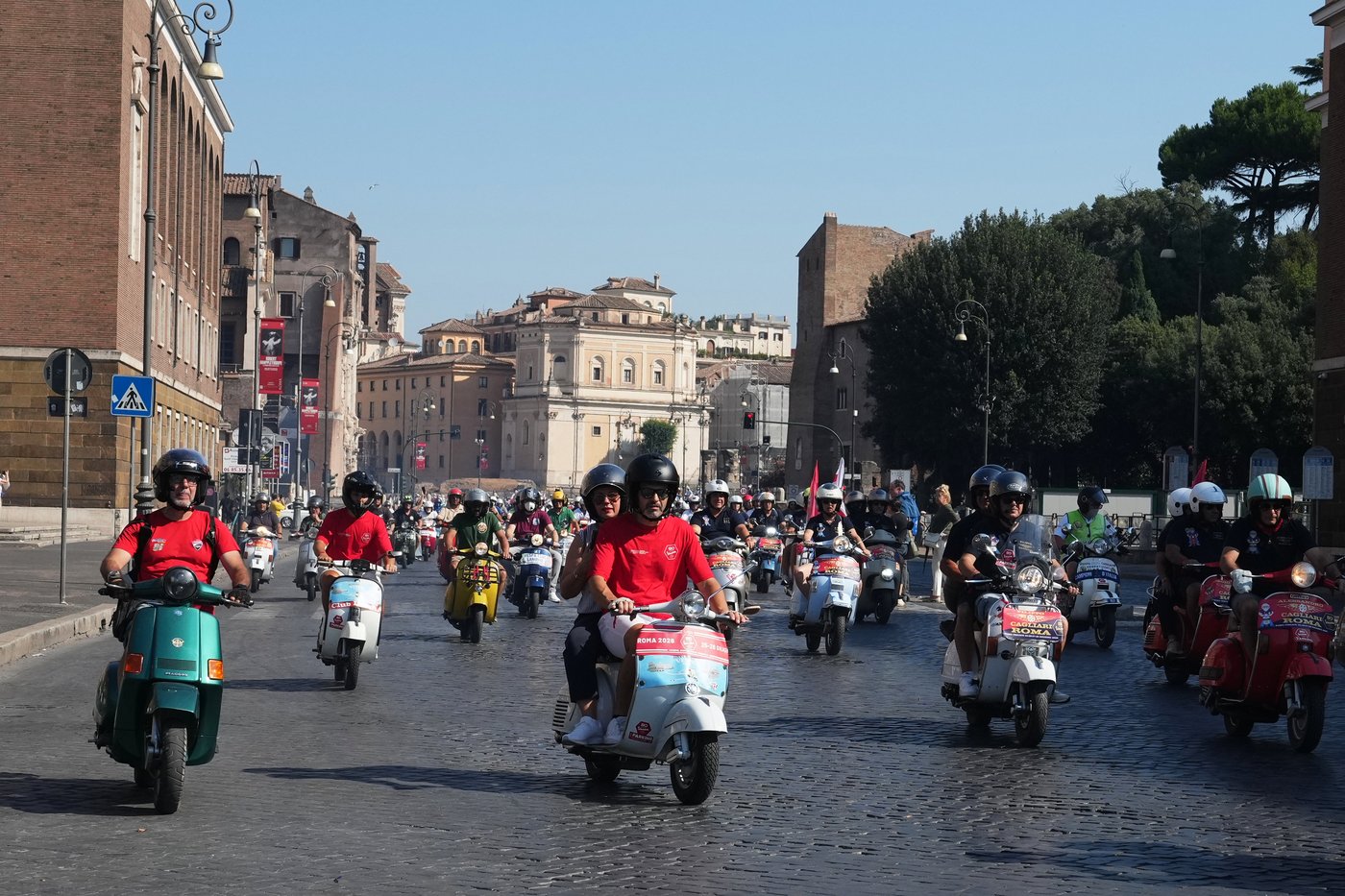 Photos show Vespa enthusiasts buzzing through Rome celebrating the little scooter's 80th anniversary | iNFOnews.ca