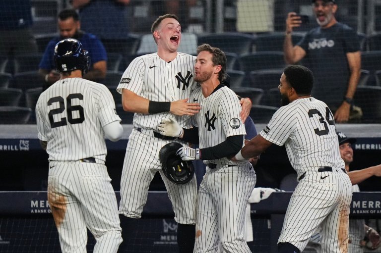 Yankees rally with 2 outs in 9th inning and beat Braves 3-2 in 10 after long rain delay | iNFOnews.ca