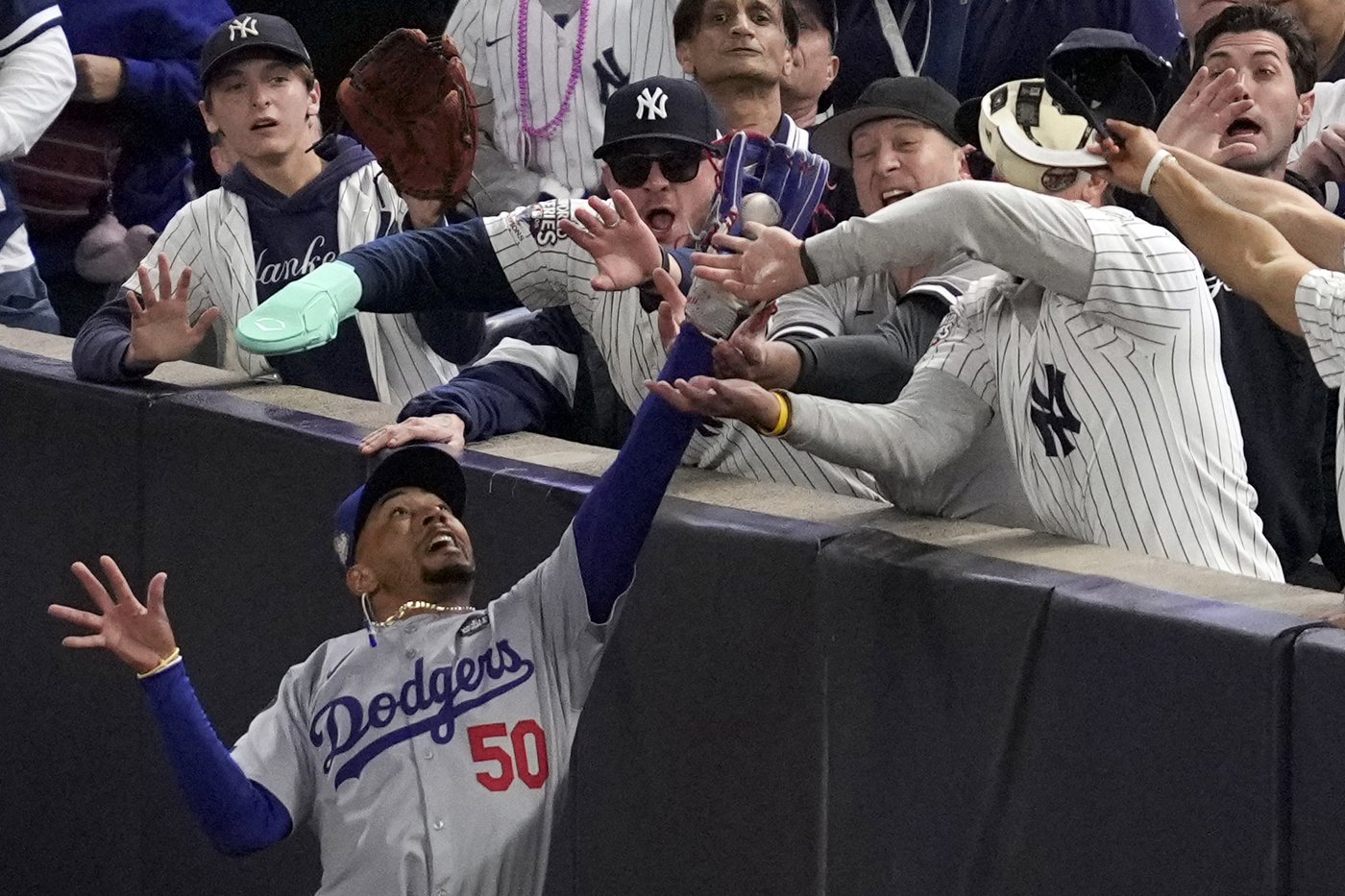 Yankees fans who interfered with Mookie Betts during World Series banned from all MLB games | iNFOnews.ca