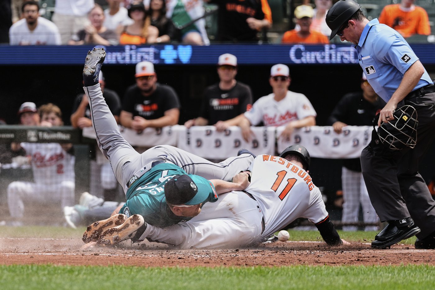 Tomoyuki Sugano earns 10th victory as Orioles outlast Mariners 5-3 after long rain delay | iNFOnews.ca