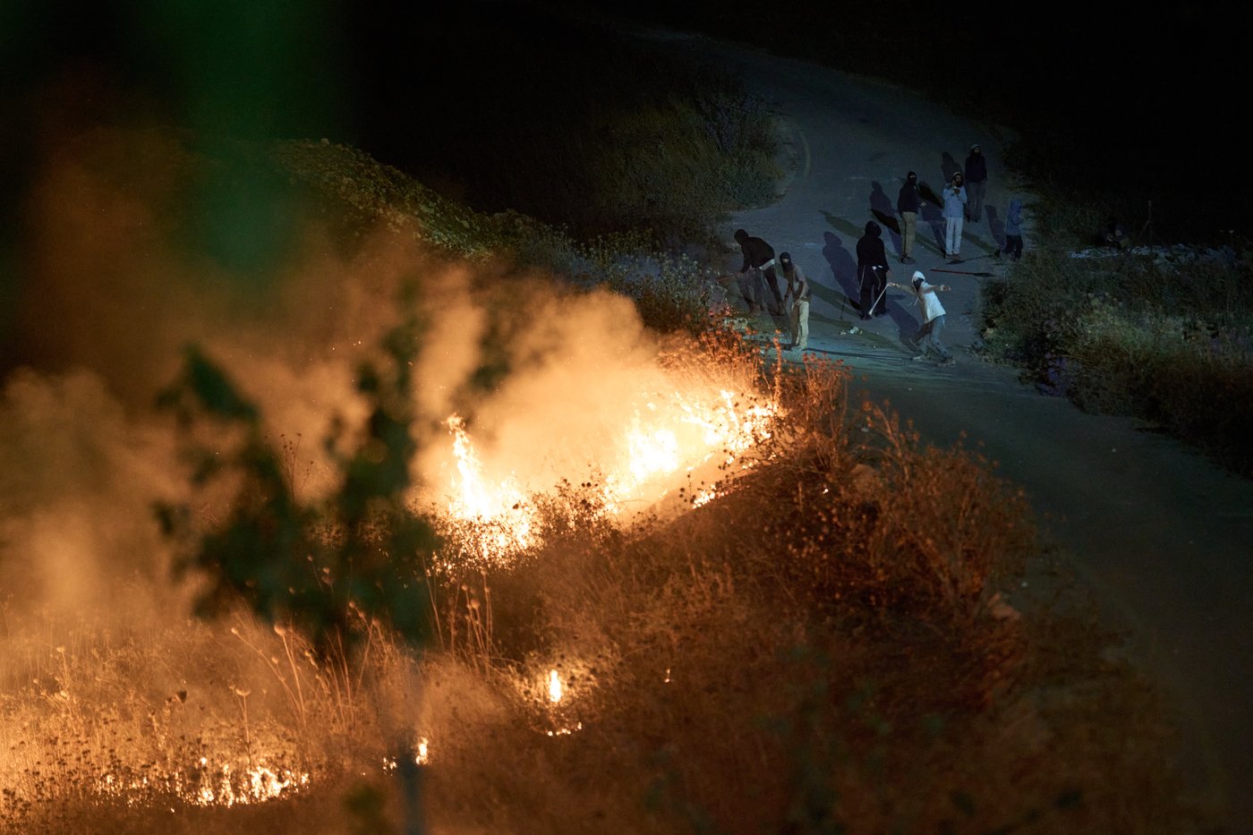 Photos show West Bank Palestinians keeping watch at night as settler violence grows | iNFOnews.ca