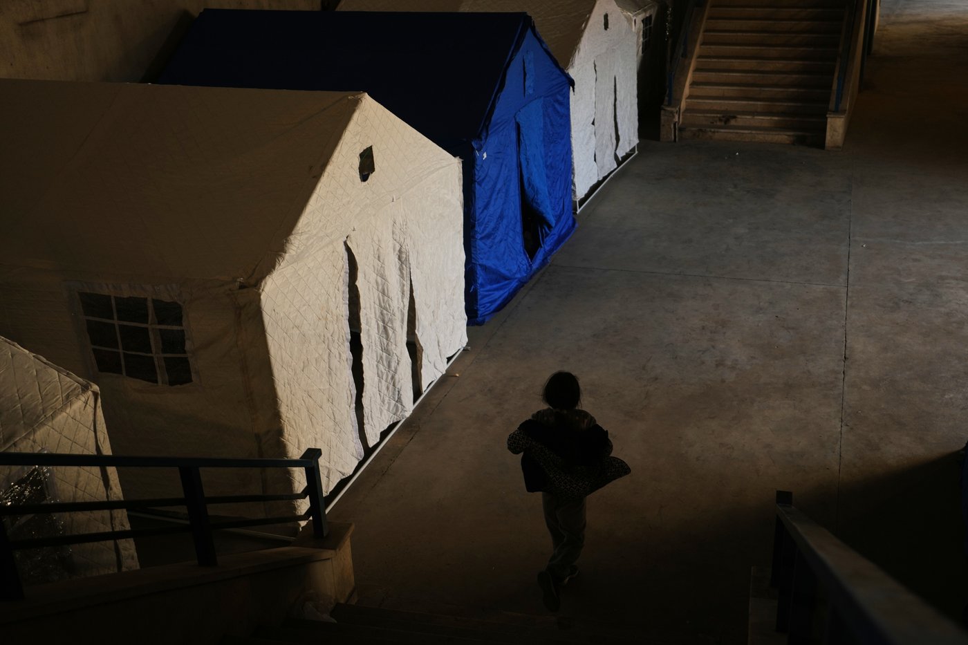 Photos of displaced civilians in Lebanon, where schools and stadiums turn into shelters during war | iNFOnews.ca