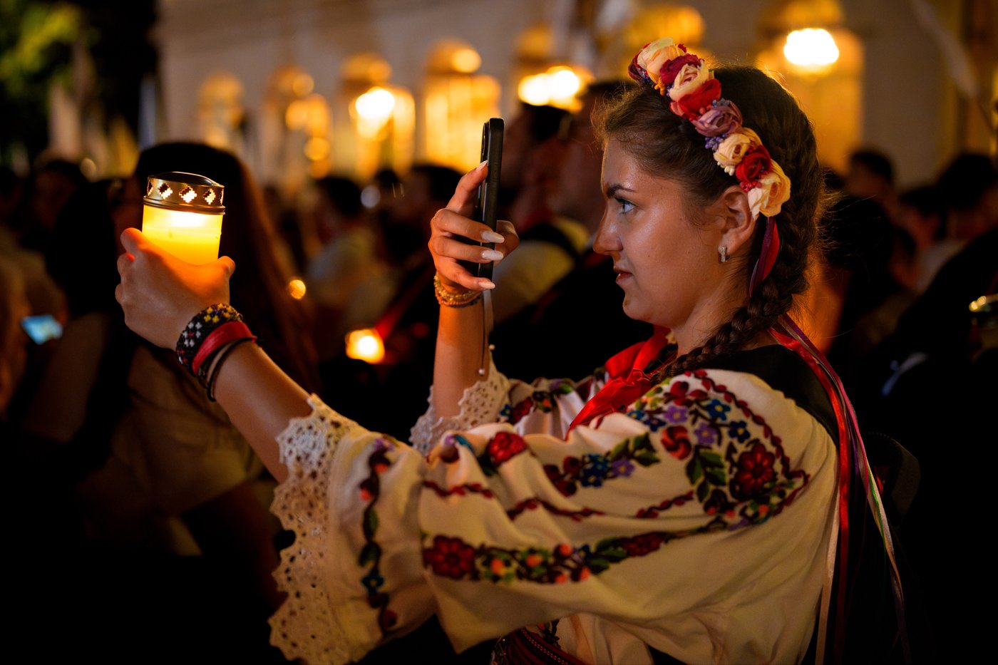 Photos of young Orthodox Christians taking part in a lights procession in Romania’s capital | iNFOnews.ca