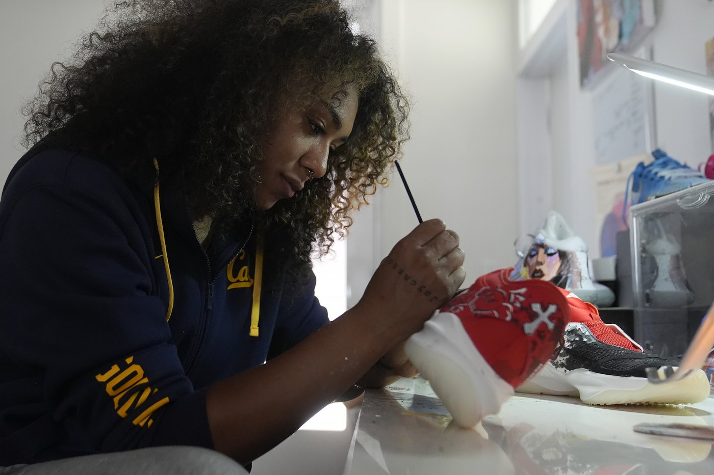 Cal guard Jayda Noble paints custom shoes to express her artistic side when she leaves the court | iNFOnews.ca