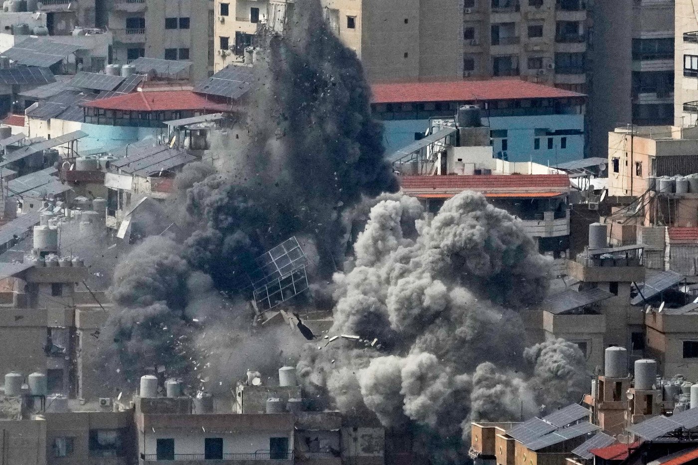 Photos show people fleeing and buildings wrecked after Israeli strikes in Lebanon | iNFOnews.ca