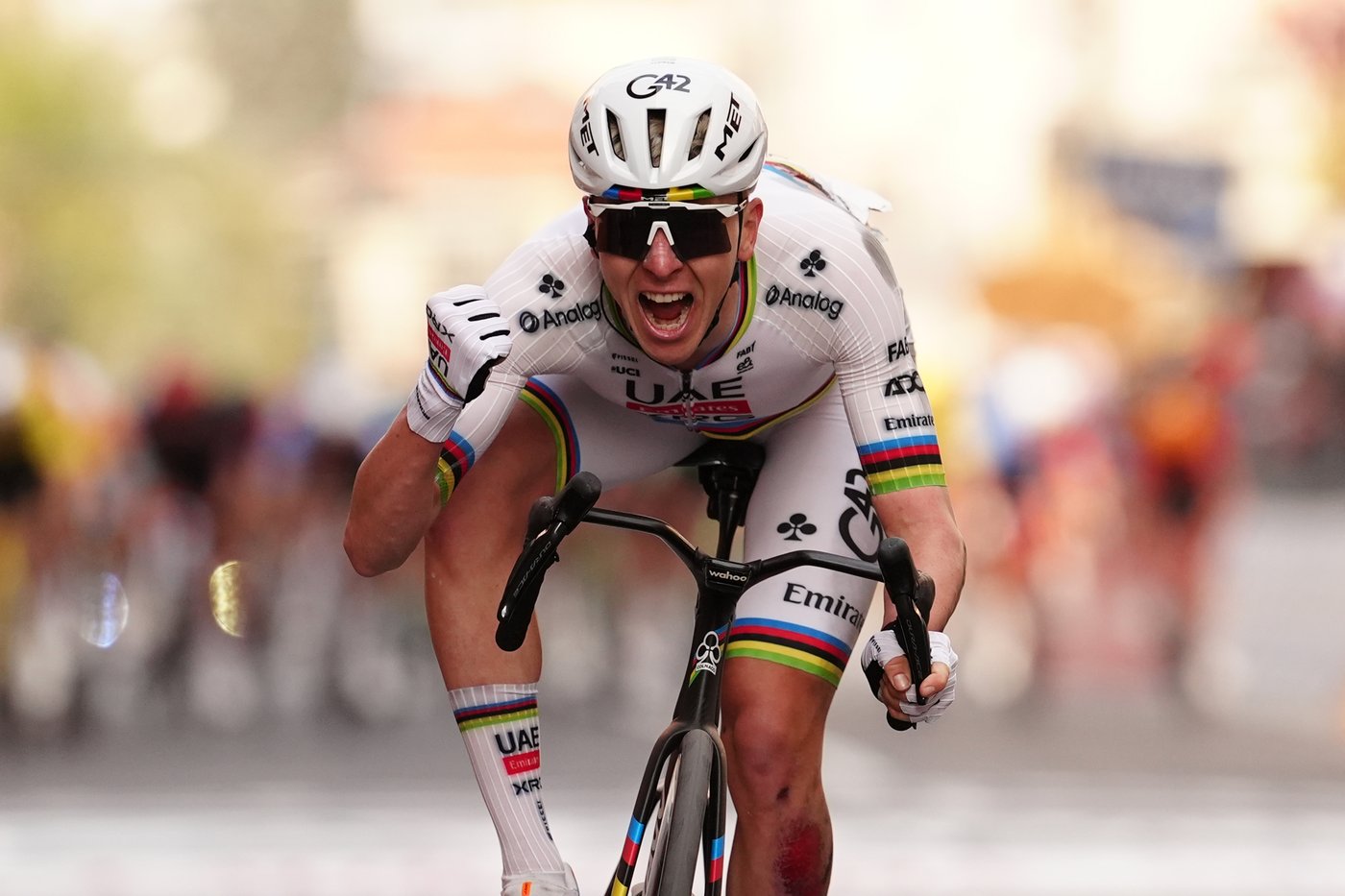 Bloodied and battered Pogacar fights back from a crash to finally conquer Milan-San Remo | iNFOnews.ca