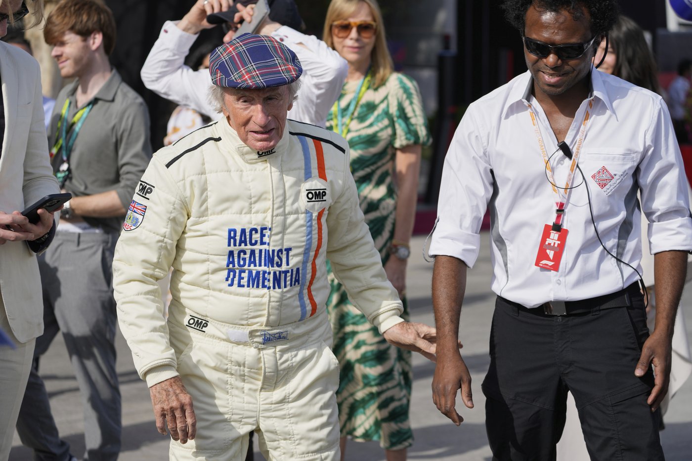 Michael Schumacher's signature on helmet worn by F1 champ Jackie Stewart at charity drive in Bahrain | iNFOnews.ca