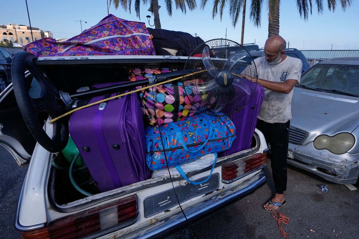 Lebanese return home to destruction after word of an initial US-Iran deal, in photos | iNFOnews.ca