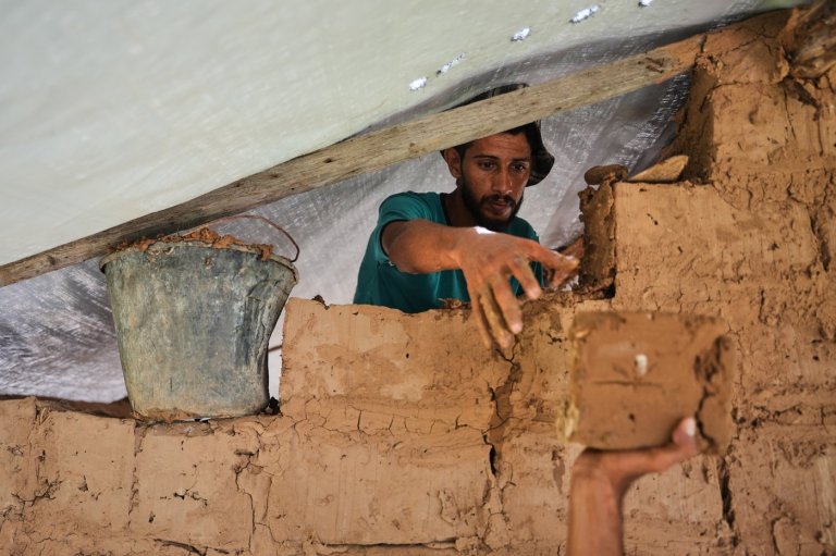 Photos show Palestinians using handmade mud bricks, wood and plastic to rebuild amid Gaza’s rubble | iNFOnews.ca