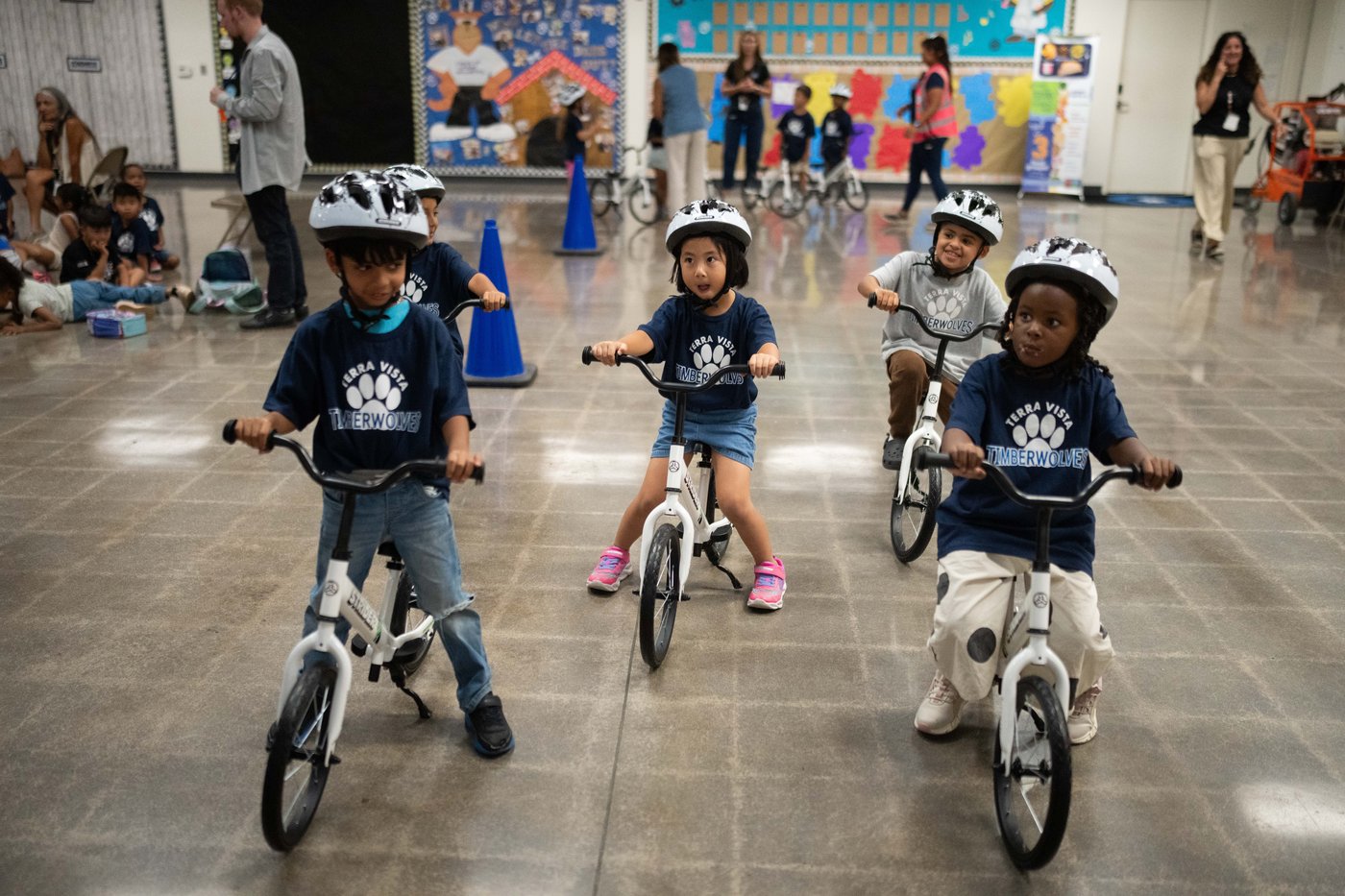 A childhood rite moves indoors as kindergartners learn to ride bikes in school gyms | iNFOnews.ca