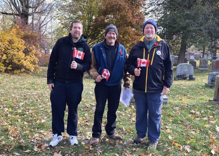 'Why we do it': More than 100 volunteers lay flags at soldiers' graves in Kingston | iNFOnews.ca