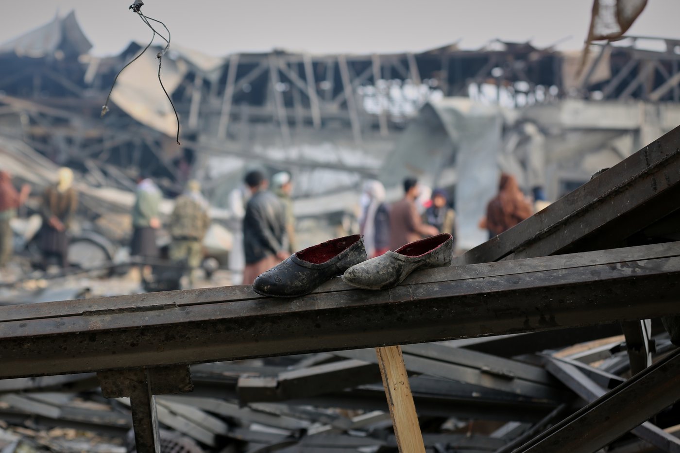 Rescue crews race through rubble after a deadly Kabul airstrike, in photos | iNFOnews.ca