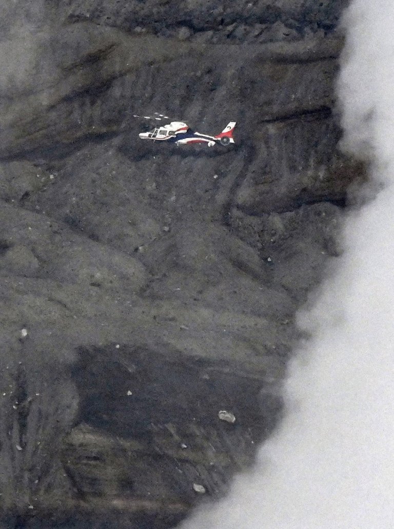Rescuers spot wreckage possibly from a helicopter that went missing near a volcano in Japan | iNFOnews.ca