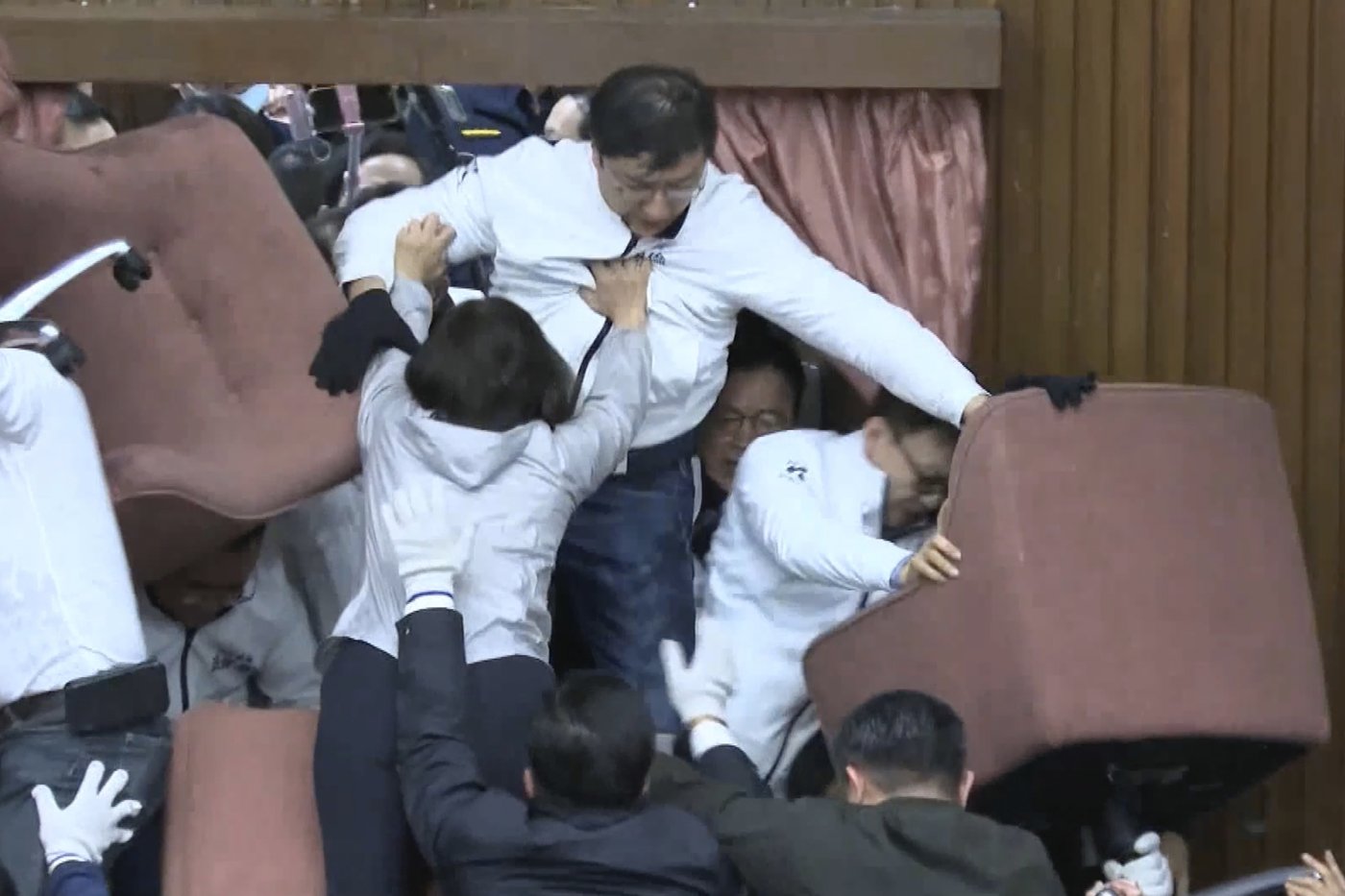Taiwan lawmakers clash after one party breaks into legislature to occupy speaker's chair | iNFOnews.ca