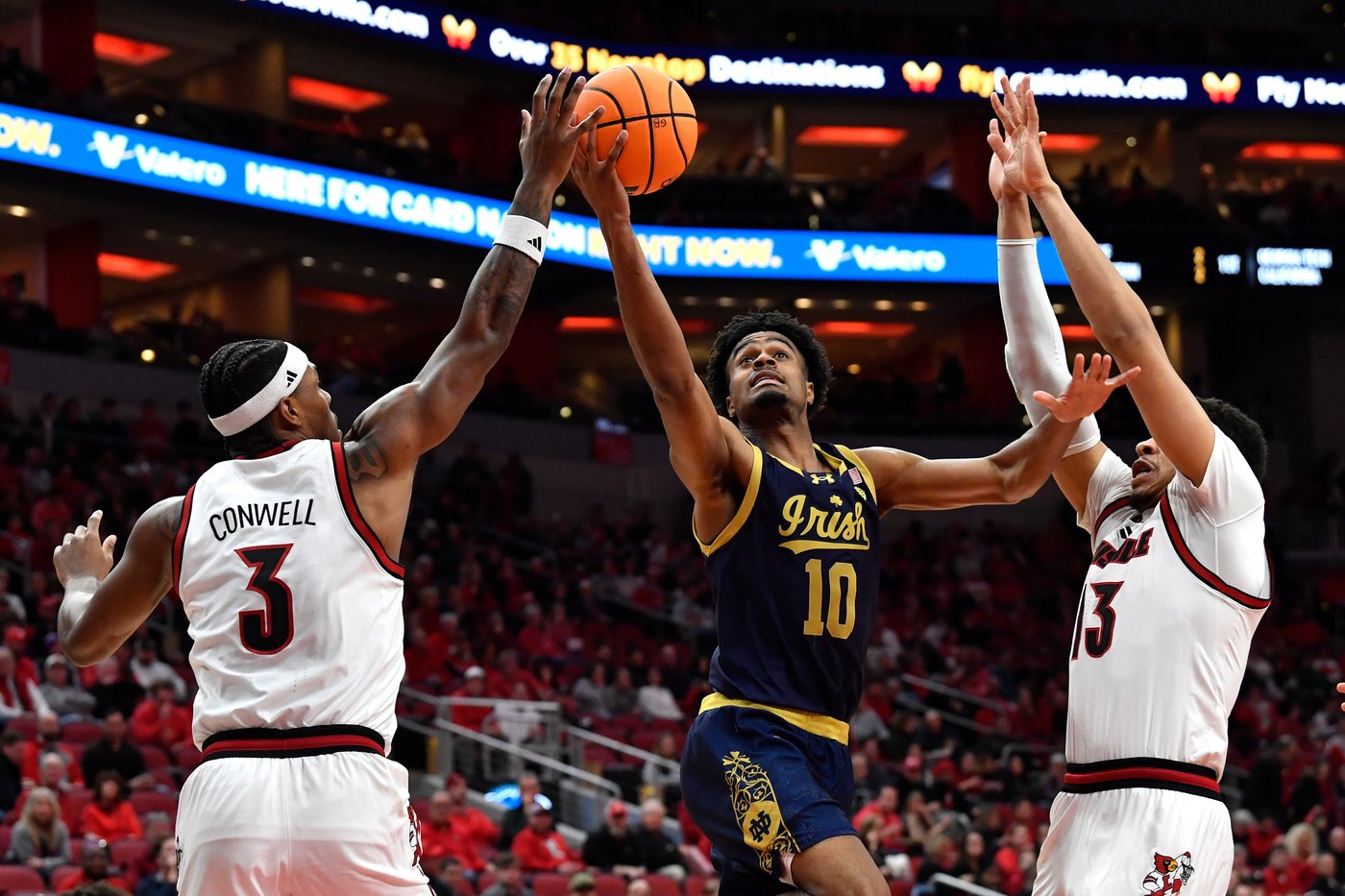 Ryan Conwell, Khani Rooths each score 12 to help No. 24 Louisville outlast Notre Dame 76-65 | iNFOnews.ca