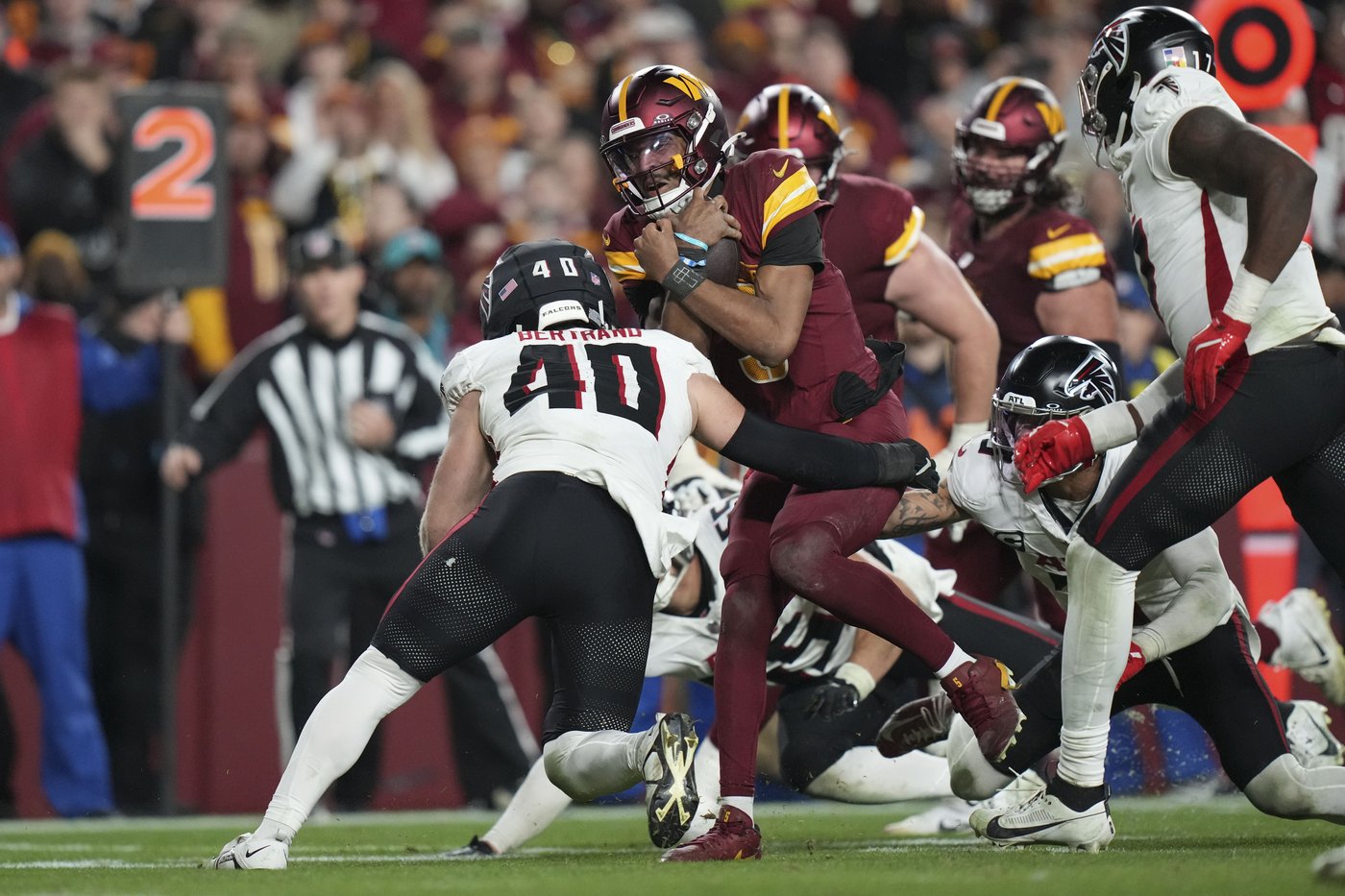 Jayden Daniels dazzles again as Commanders clinch a playoff spot by beating Falcons 30-24 in OT | iNFOnews.ca
