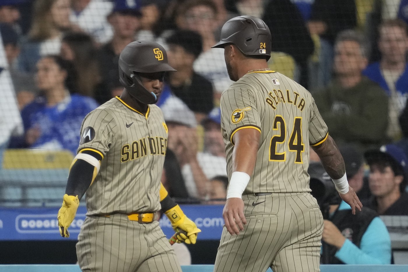 Dodgers rally with 5 runs in 7th and beat Padres 7-2 to clinch 11th NL West title in 12 years | iNFOnews.ca