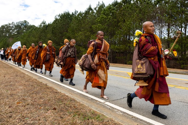 Buddhist monks persist in peace walk despite injuries as thousands follow them on social media | iNFOnews.ca