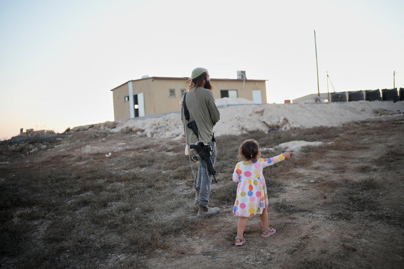 Israeli settlers, some armed, celebrate a new synagogue in the occupied West Bank, in photos | iNFOnews.ca