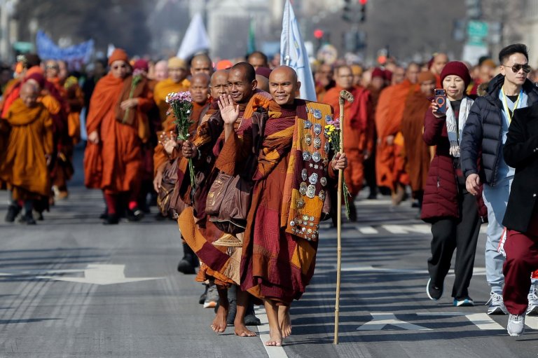 Photos of monks and rescue dog as they finish cross-country peace walk in Washington, DC | iNFOnews.ca