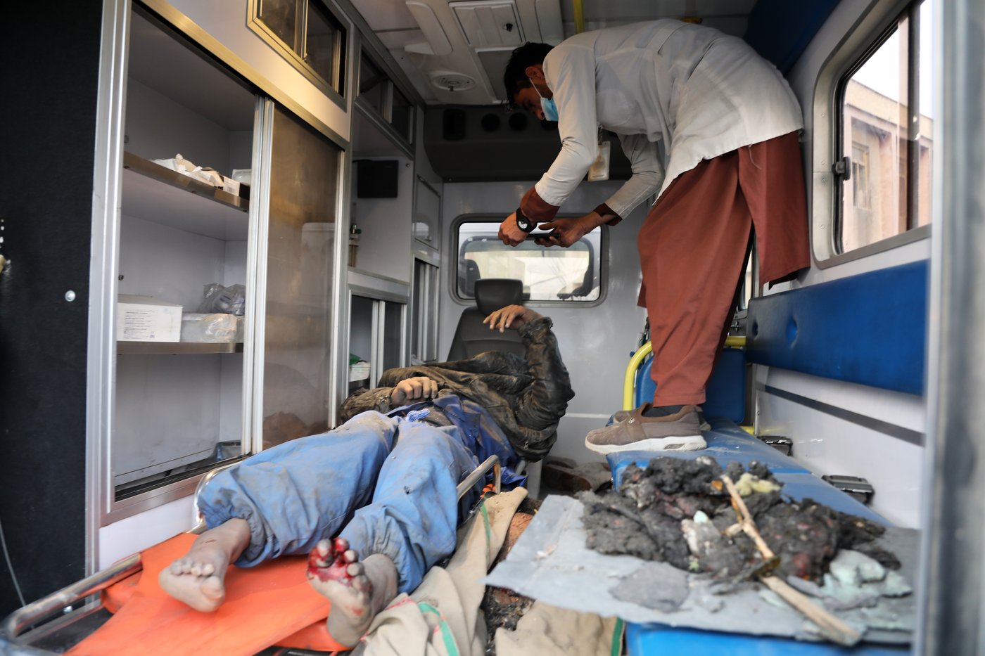 Rescue crews race through rubble after a deadly Kabul airstrike, in photos | iNFOnews.ca