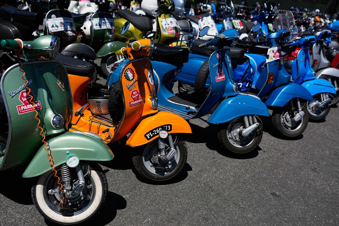 Photos show Vespa enthusiasts buzzing through Rome celebrating the little scooter's 80th anniversary | iNFOnews.ca