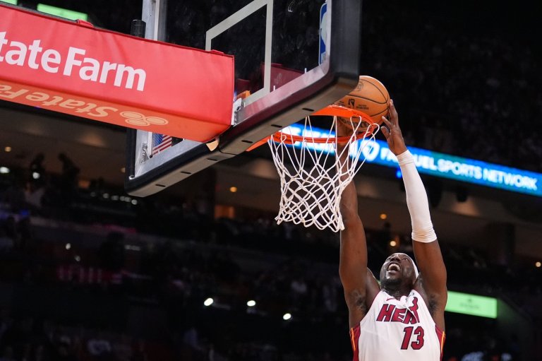 Heat's Bam Adebayo taken to locker room after LaMelo Ball trips him, leading to hard fall | iNFOnews.ca