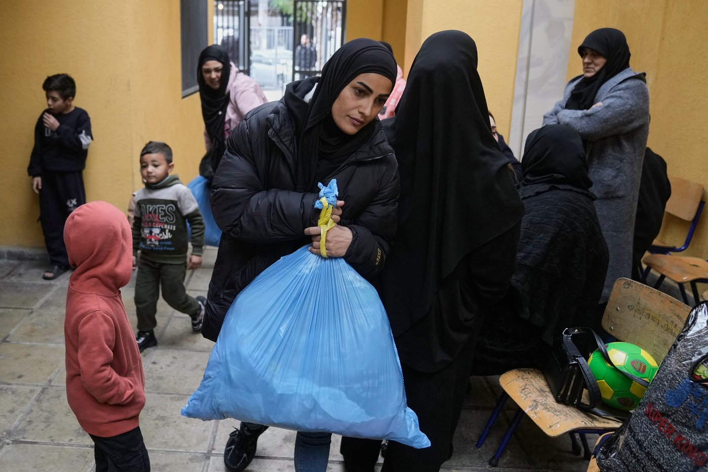 Photos of displaced civilians in Lebanon, where schools and stadiums turn into shelters during war | iNFOnews.ca