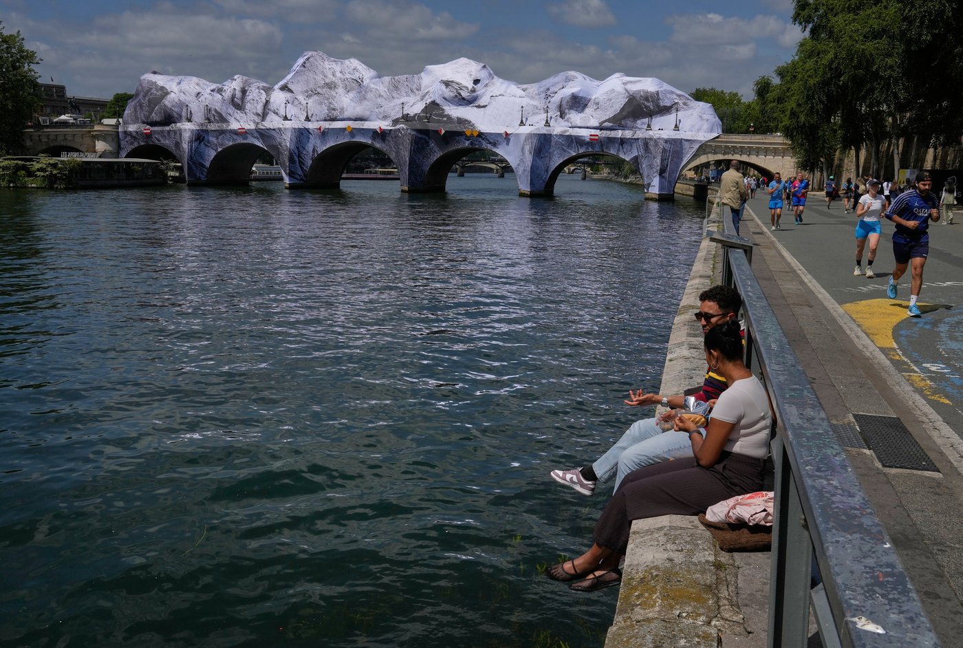 Artist JR, the 'French Banksy' creates a 'cave' installation over Paris' oldest bridge | iNFOnews.ca Artist JR, the 'French Banksy' creates a 'cave' installation over Paris' oldest bridge | iNFOnews.ca