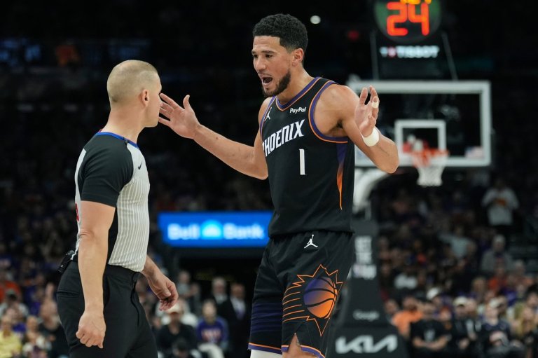 Suns' Booker hurts ankle after tripping over Dort's foot, says he doesn't know if it was on purpose | iNFOnews.ca
